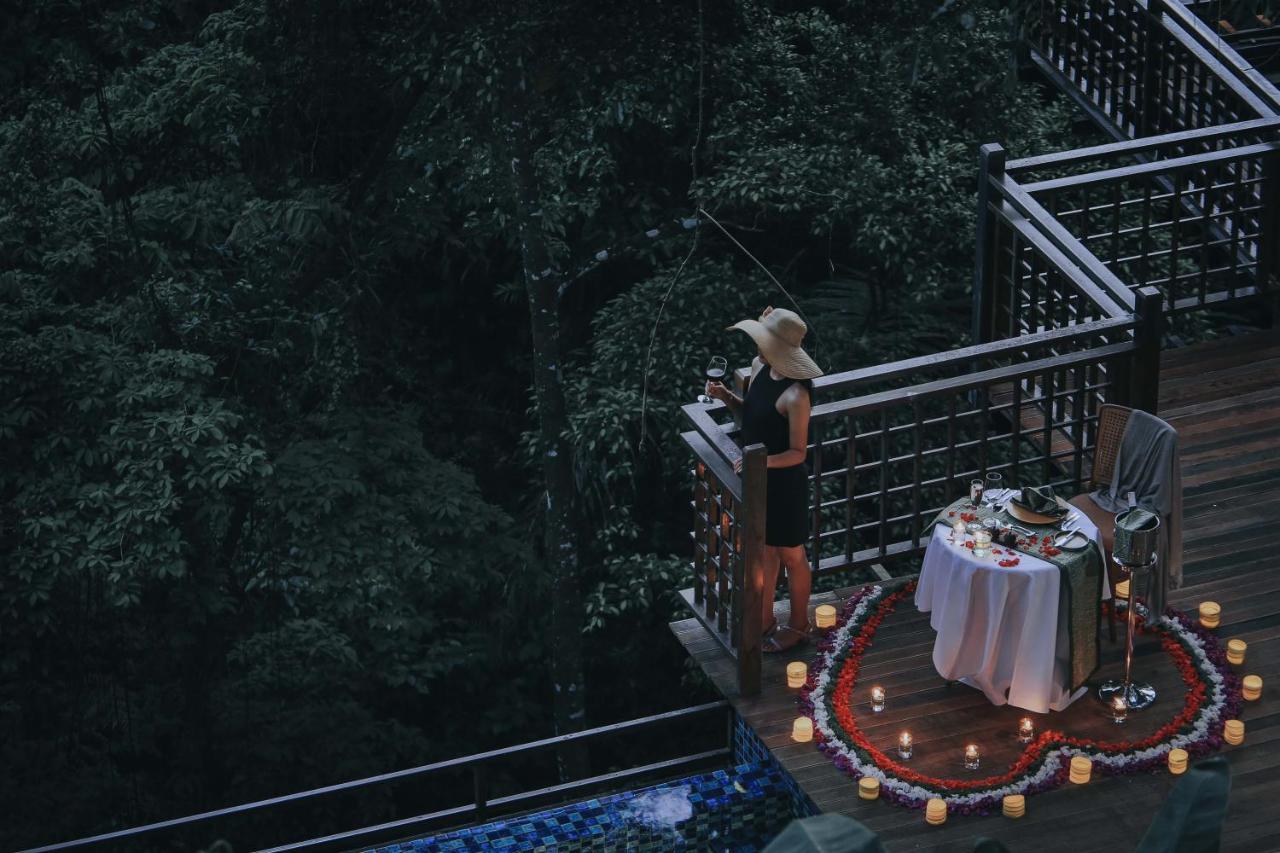 The Sebali Resort Убуд Екстериор снимка A woman at a romantic dinner